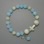 Bracelet with aquamarine acrylic beads and mother-of-pearl smooth beads, diameters 10 mm, 8 mm, 7.5 mm, length 18 cm +/- (stretch) with metal inserts