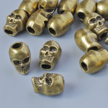 Bead-insert finding 'Skull', 9x6 mm, hole diameter 2.6 mm, pack 18 pcs +- bronze-colored metal