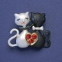 Brooch 'Loving Kittens' black and white enamel with red crystals, gold-tone metal, 28x33mm+
