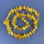 Amber chip beads 9–14×3–6 mm with 3 mm seed beads on a thread, length 38 cm