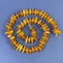 Amber chip beads 10-12x3-4 mm, with 3 mm seed beads on thread, length 39 cm