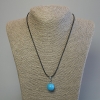 Turquoise ball pendant 16mm +/- on a black waxed cord, 1.5 mm diameter, length 44 cm +/-