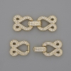 Two-thread clasp with white crystals, diameter 30x12 mm, gold-tone metal