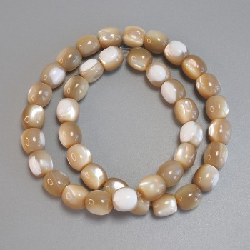 Beige mother-of-pearl barrel beads, diameter 10×9, 5 mm +/-; length 40 cm +/- on thread
