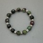 Bracelet with faceted zoisite cubes 9x9 mm +/- with metal inlays, length 18 mm +/- stretch