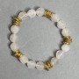 Elastic bracelet with faceted rock crystal beads 10x9 mm ±, with metal inlays, length 18 cm ±