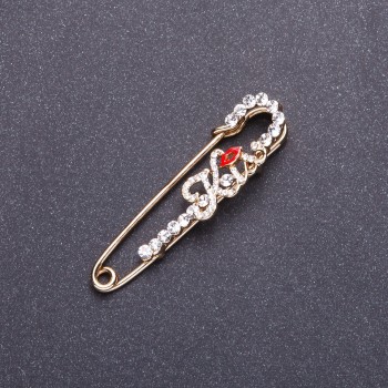 Brooch pin 'Kiss' in golden metal 5.8 x 1.4 cm
