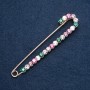 Coat brooch pin in multicolored rhinestones, 100x20 mm, metal color 'gold'