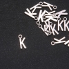 Pendant fittings Letter 'K' 17x7 mm Packaging 20 g (±25 pcs)