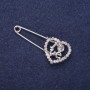 Brooch-pin 'Heart LOVE' with white crystals 43×18 mm silver-tone metal