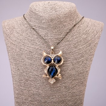 Pendant 'Owl' with blue crystals on a long chain of black-gold metal, diameter 41×62 mm, length 70 cm