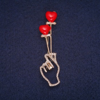 Brooch 'Symbol of Love' with red enamel and white crystals, gold-tone metal 16x62 mm
