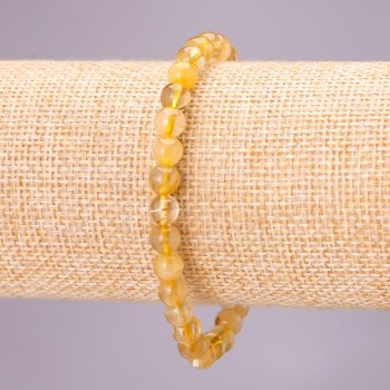 Bracelet made of natural rutilated quartz on elastic, smooth beads, diameter 6(±) mm, length 18 cm