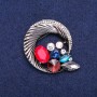 Round brooch with rhinestones, woven into a beautiful composition, dark metal, 45x50 mm