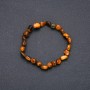 Bracelet made of natural Tiger's Eye on elastic, diameter 7x9 mm (±), circumference 18 cm