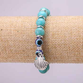 Bracelet-amulet Turquoise with blue 'eyes' on an elastic band, diameter 10 mm (±), length 18 cm with inlays and a pendant