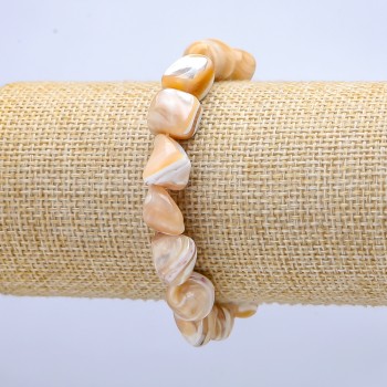 Elastic bracelet natural beige. Faceted mother-of-pearl, diameter 19×12 mm, length 18 cm+