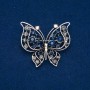Butterfly Brooch in silvery metal with blue, gray, white, and gasoline-colored crystals, 46x52 mm +