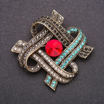 Brooch with red crystal and blue and gray rhinestones, 47×59 mm, yellow metal
