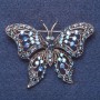 Brooch 'Butterfly' with blue chameleon crystals, silver-tone metal, 6×4 cm