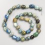 Beads of Chrysocolla and Sodalite natural stone, hammered texture on thread, diameter 8x10 mm, length 40 cm