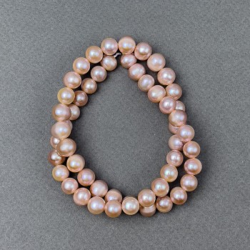 Peach freshwater pearls on a thread, diameter 9x8 mm, length 40 cm