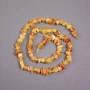 Amber chip beads on thread, diameter 7x4 mm +/-, length 39 cm+