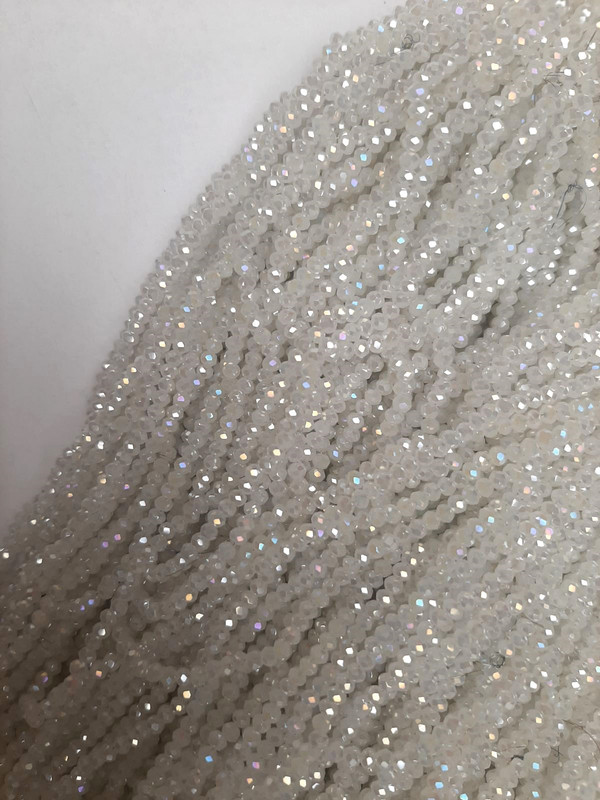 Beads of white Czech crystal with a gasoline tint, faceted rondelle, diameter 3x2.5 mm, length 40 cm ± on a beading thread