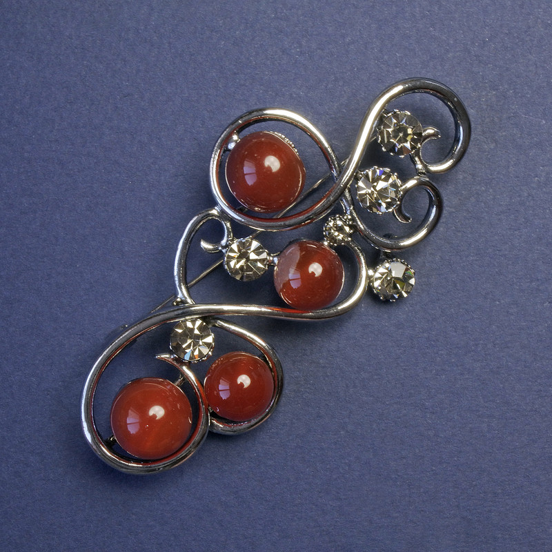 Carnelian brooch with gray rhinestones, metal color "silver" 75x37 mm+