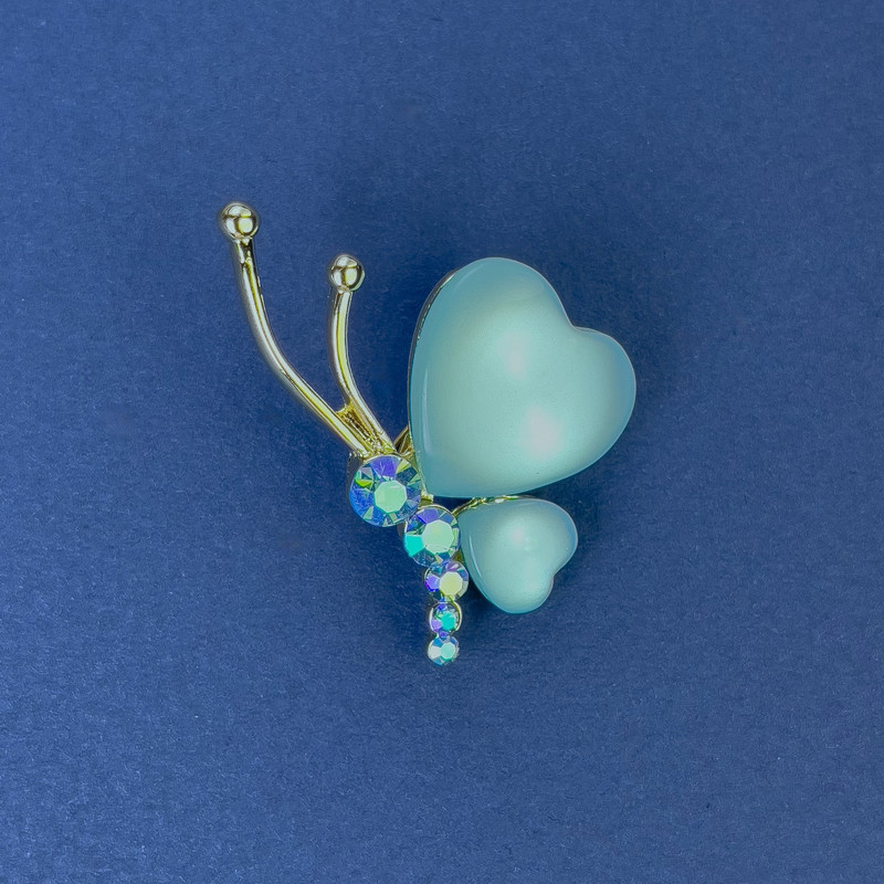 Brooch Butterfly, diameter 34×21 mm ± blue Cat's Eye with crystals, gold-tone metal