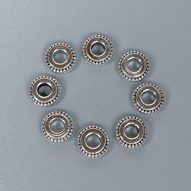 Bead insert finding, silver metal color, 7×3 mm with hole diameter approx. 3 mm, packaging 20 g (~45 pcs)