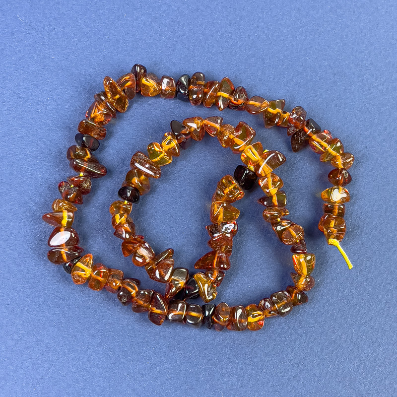 Amber chip beads 6–10×4 mm on thread, length about 38 cm+