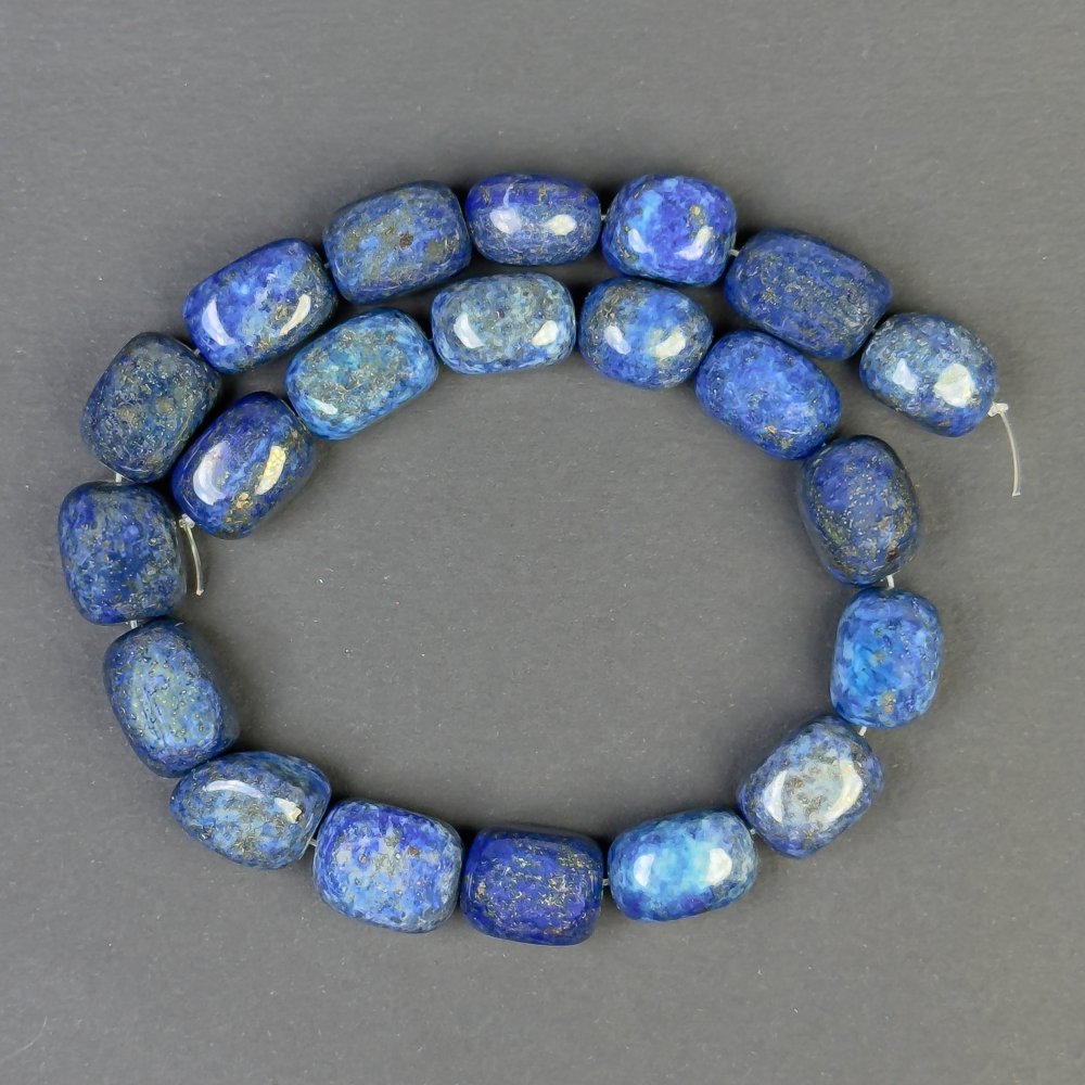 Faceted lapis lazuli beads 18x13 mm on beading wire, 38 cm long
