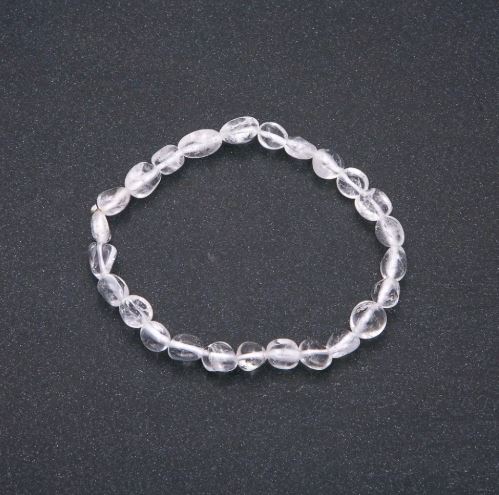 Bracelet of natural rock crystal on elastic, tumbled beads, bead size 7×9 mm (±), circumference 18 cm