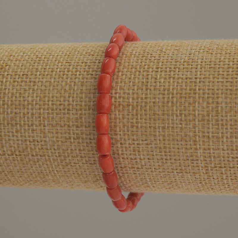 Barrel-shaped artificial coral bracelet, bead diameter 6x4 mm, 5 mm +/-; length 18 cm, stretch