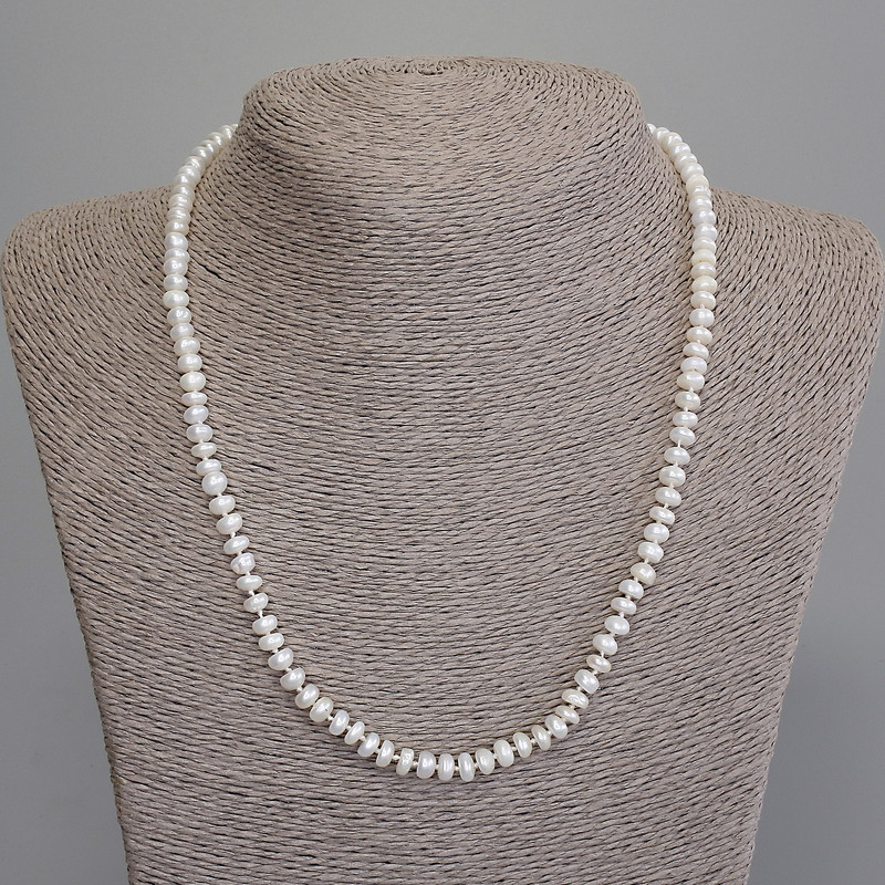 Necklace of natural freshwater pearls 5×3 mm, length 47 cm, with a clasp