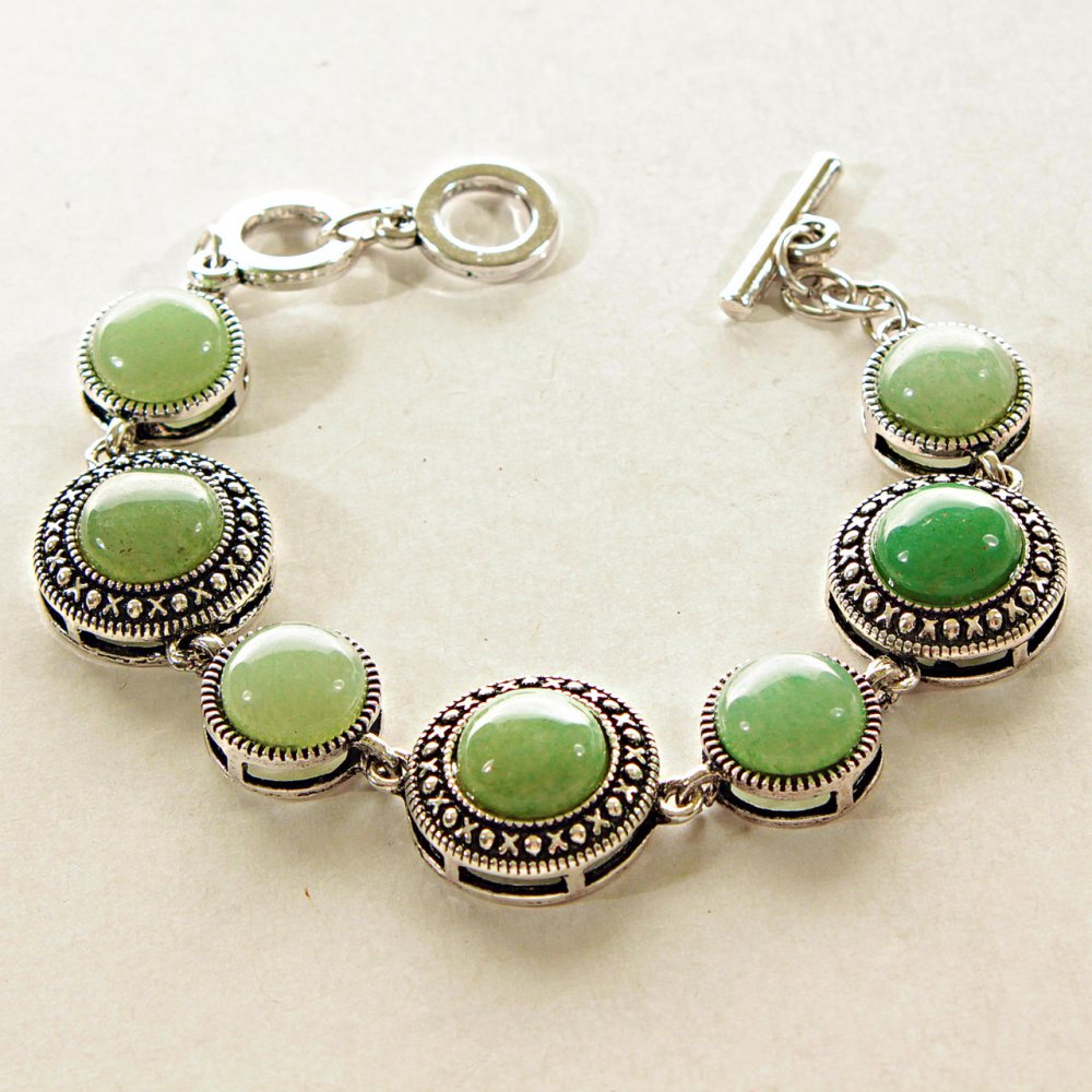 Clearance. Jade bracelet in bezel 'Dot Cross' with round stones, larger and smaller, 7 stones, 19 and 15 mm, length 18-21 cm