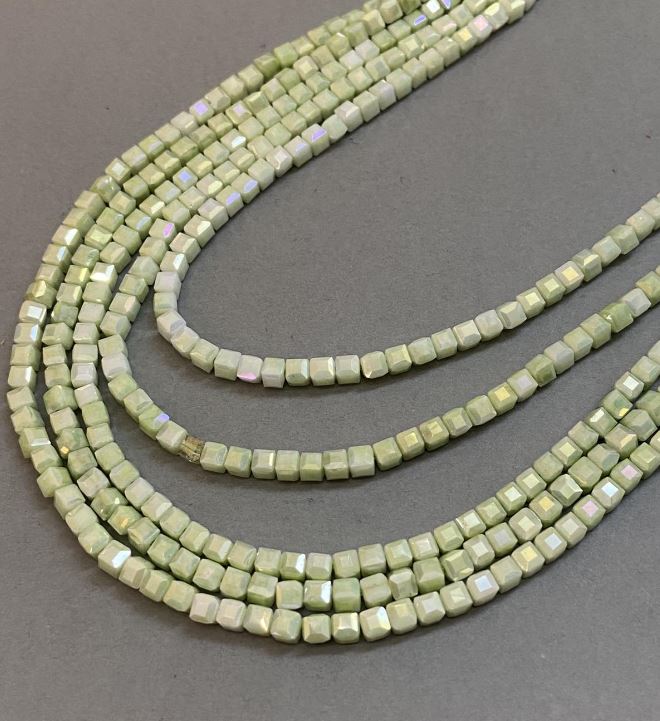 Beads Czech Crystal Chartreuse with petrol coating on thread, faceted cube, diameter 4x4 mm, length 38 cm