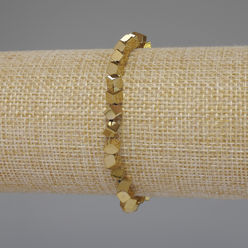 Gold-colored hematite bracelet — cube-shaped with through hole, 4×4 mm, 18 cm stretch