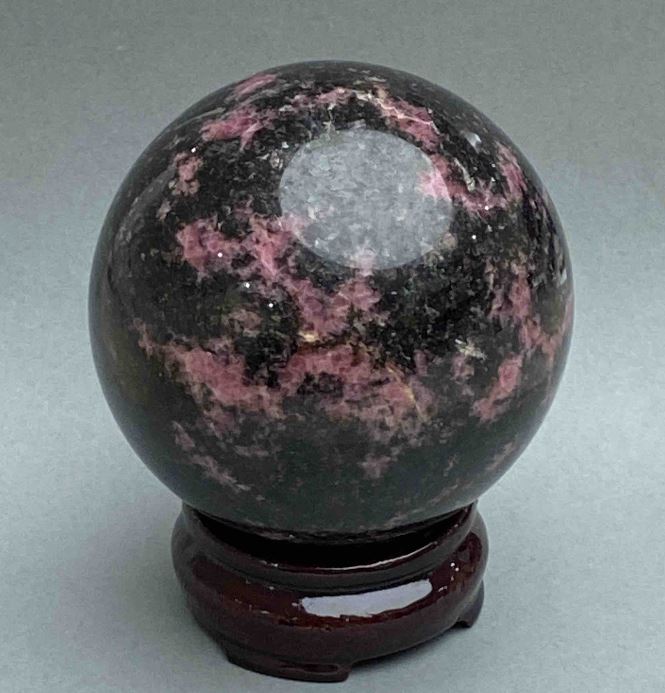 Souvenir sphere made of natural rhodonite, diameter 80 mm ± (weight from 986 g)