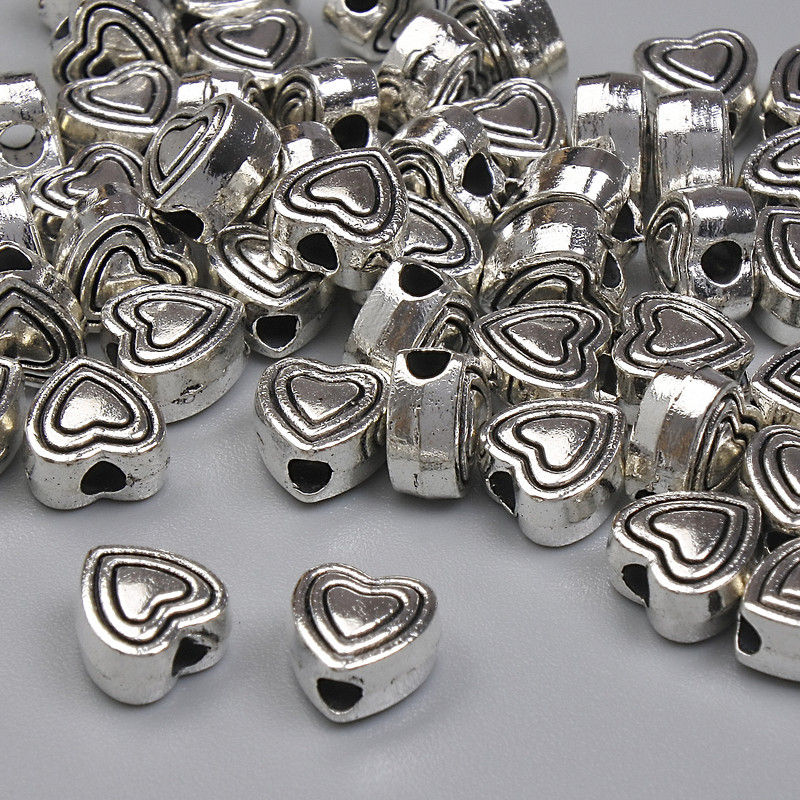 Heart-shaped silver-tone bead insert, 6mm diameter, hole 1.6mm, packaging 20 g (~45 pcs)