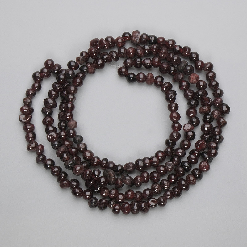 Faceted Garnet Beads, 5–6.5 × 4–5 mm, on thread, length 80 cm+