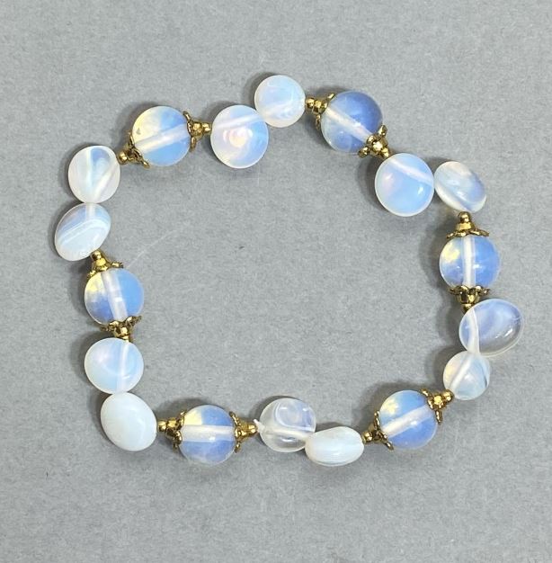 Opalite Bracelet with smooth beads, about 9 mm in diameter and 8–10×8 mm tumbled beads, with metal inserts, length 18 cm, stretch