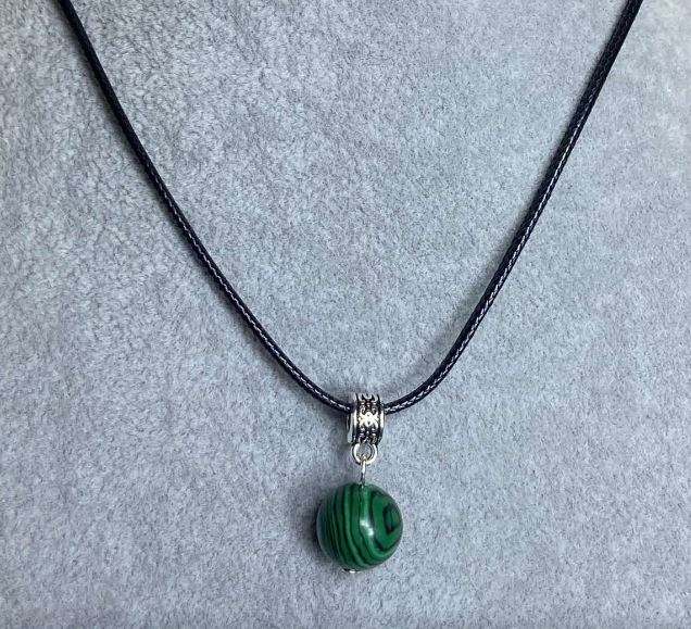 Malachite ball pendant, 12 mm diameter, on a cord, 60 cm length with an additional 5 cm chain