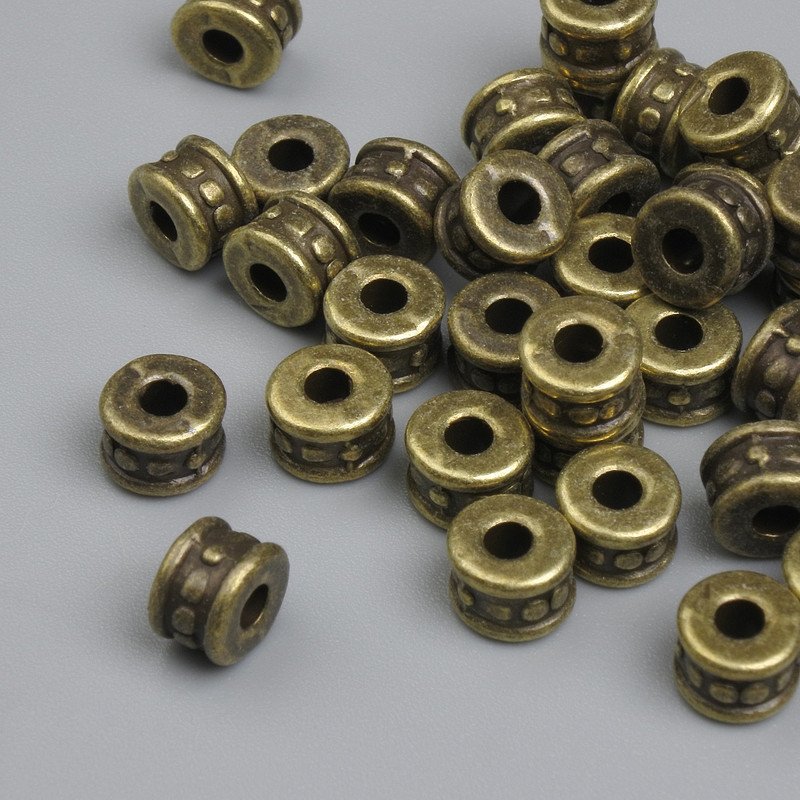 Bronze-colored bead insert, diameter 5.5×4 mm, hole diameter approx 3 mm, packaging ~32 pcs.