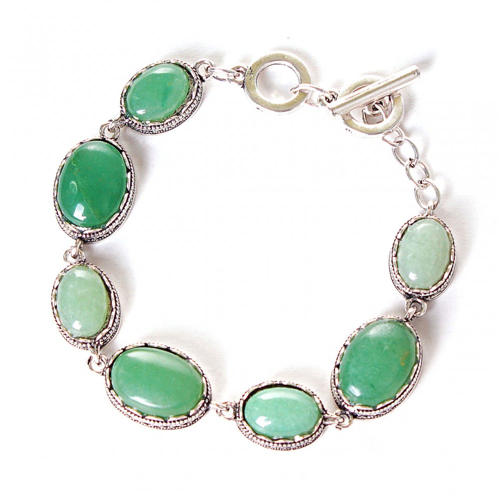Clearance. Jade bracelet with a 'tooth' bezel, seven oval stones 20x16 mm and 13x16 mm, length 18-21 cm