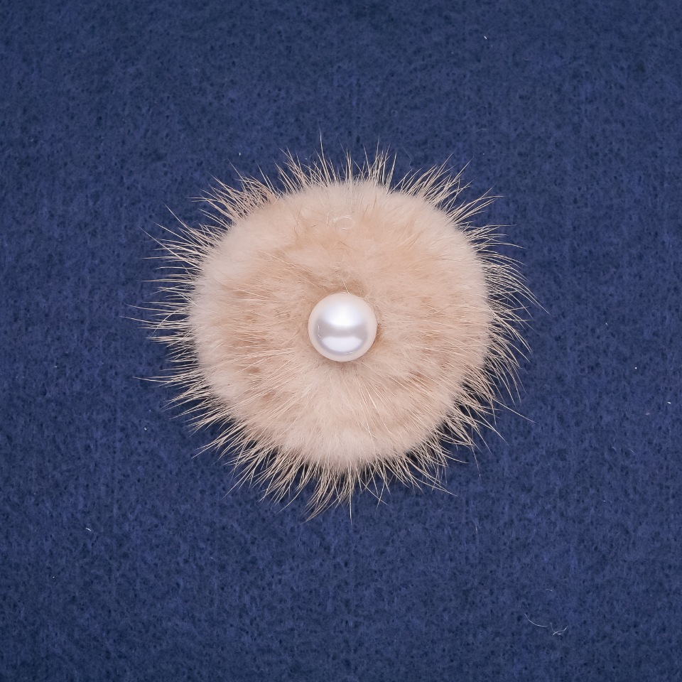 Beige mink fur brooch with a bead, diameter 50 mm