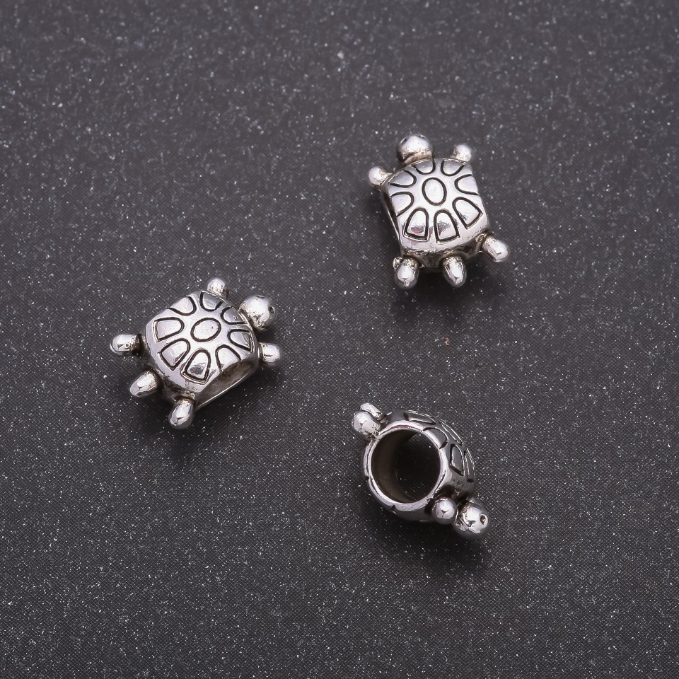 Bead insert Turtle, 12x8mm diameter, inner diameter 5mm, packaging 20g ± 21 pcs