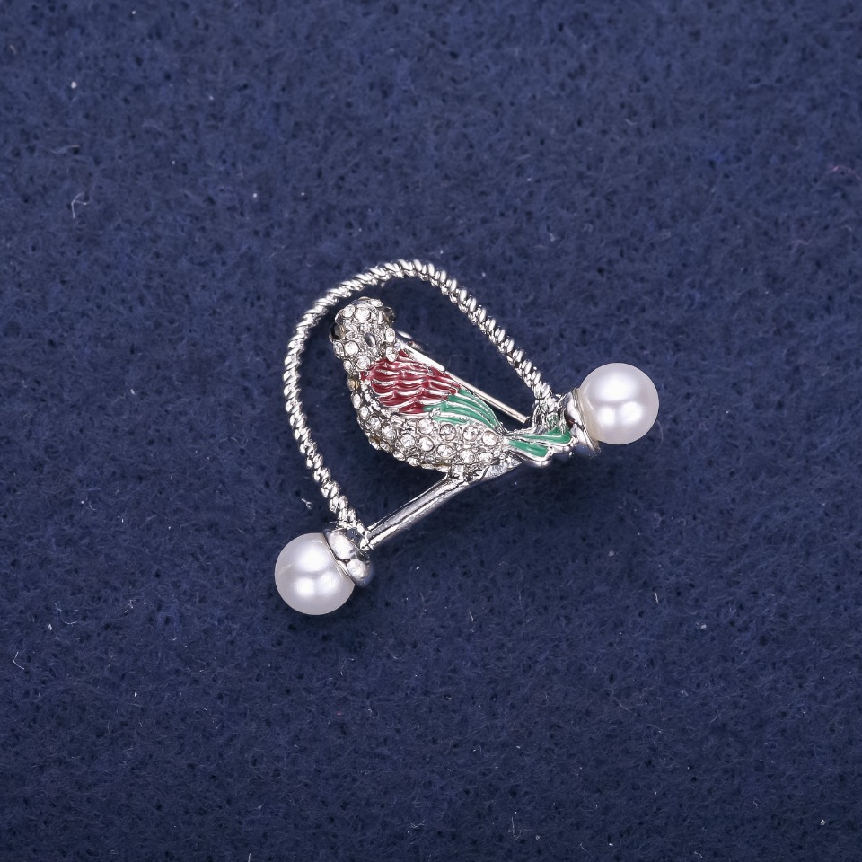 Bird Brooch with crystals green-burgundy color 32×23 mm silver-colored metal