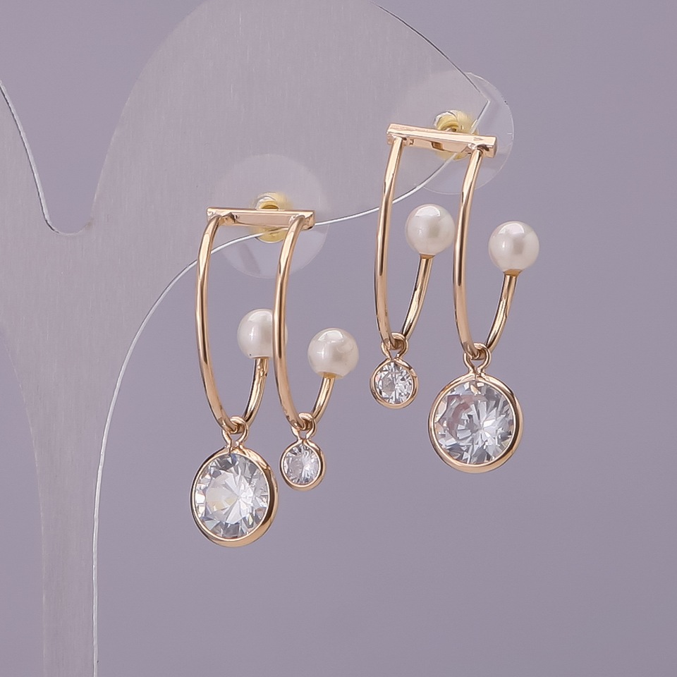 Stud earrings 'Clasp' with white crystals and a pearl, gold-toned metal 22×31 mm